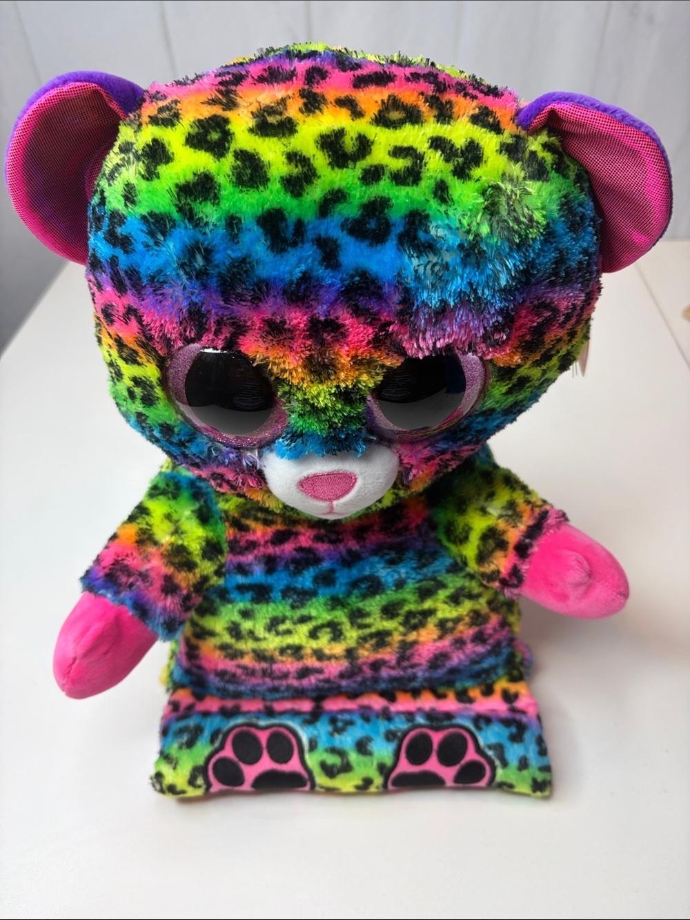 This is a Ty Beanie Peek-A-Boos Lance The Rainbow Leopard tablet holder NWT